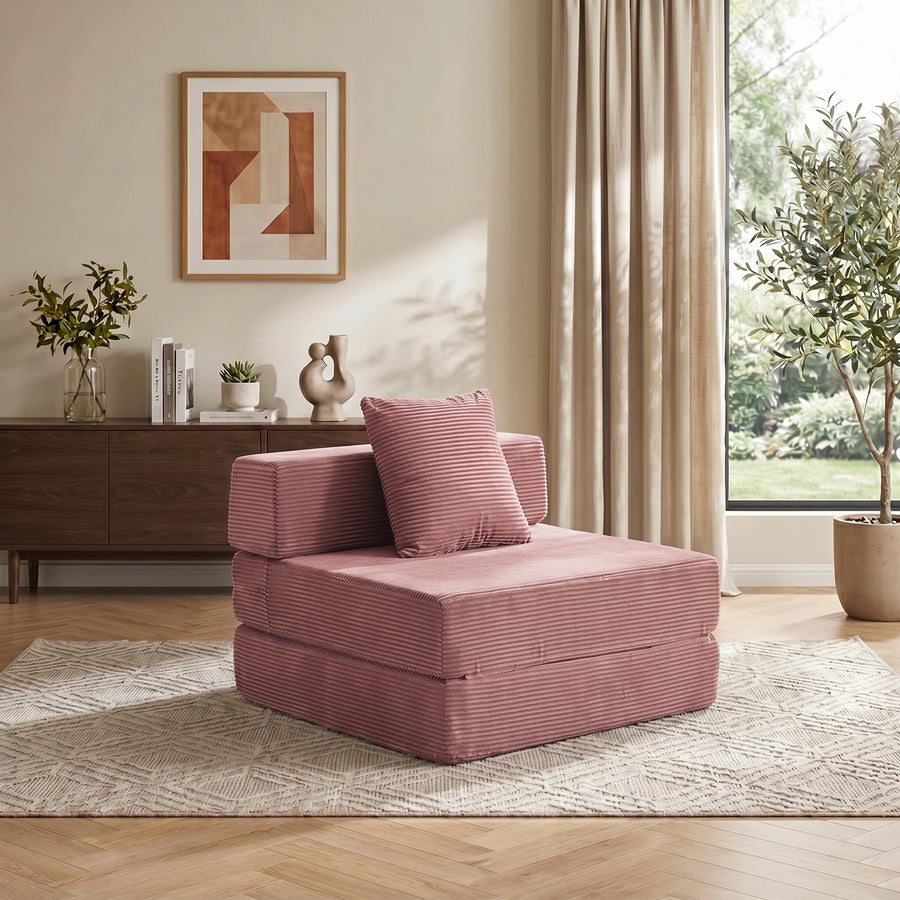 1-Sitzer-Cordsofa in Rosa mit gestuftem Sitzblock und Zierkissen auf dem Oberteil.